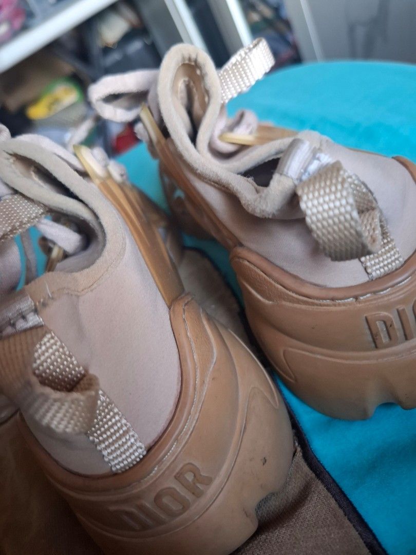 Dior Sneakers - Beige/Tan (Category: Sneakers) located in Marikina City. Submitted by bags21.ph (Listing ID 1462437925, Image 1). Description: - Authentic Dior sneakers - Chic beige and tan colorway - Classic lace-up design - Dior logo detail on the sole - Ideal for everyday casual outfits.