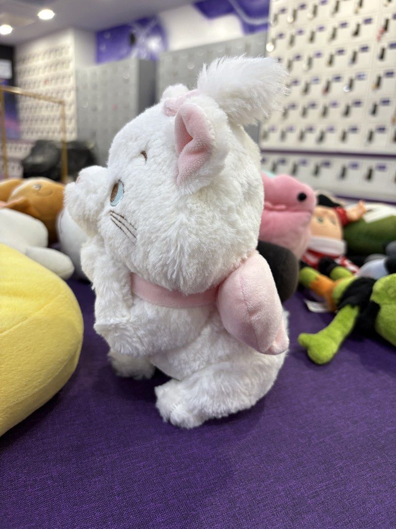 Disney Marie Cat Plush (Category: Plushies & Soft Toys) located in Taguig. Submitted by goofysofties (Listing ID 1462337716, Image 2). Description: - 8 inches - Adorable Marie cat plush from Disney's The Aristocats. - Features soft white fur. - Adorned with a cute pink bow on its head and a larger pink bow on its back. - Approximately the size of a pen. - Ideal for collectors and fans of Marie. - Perfect for display or as a cuddly toy..