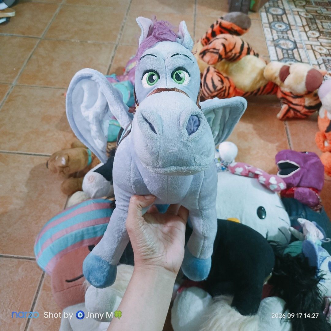 Disney Store Pegasus Plush Toy (Category: Plushies & Soft Toys) located in Taguig. Submitted by mhayestufftoys (Listing ID 1462426124, Image 1). Description: - Authentic Disney Store Pegasus plush toy - Light blue body with purple mane and wings - Comes with a saddle and bridle - Ideal for Disney collectors and fans.