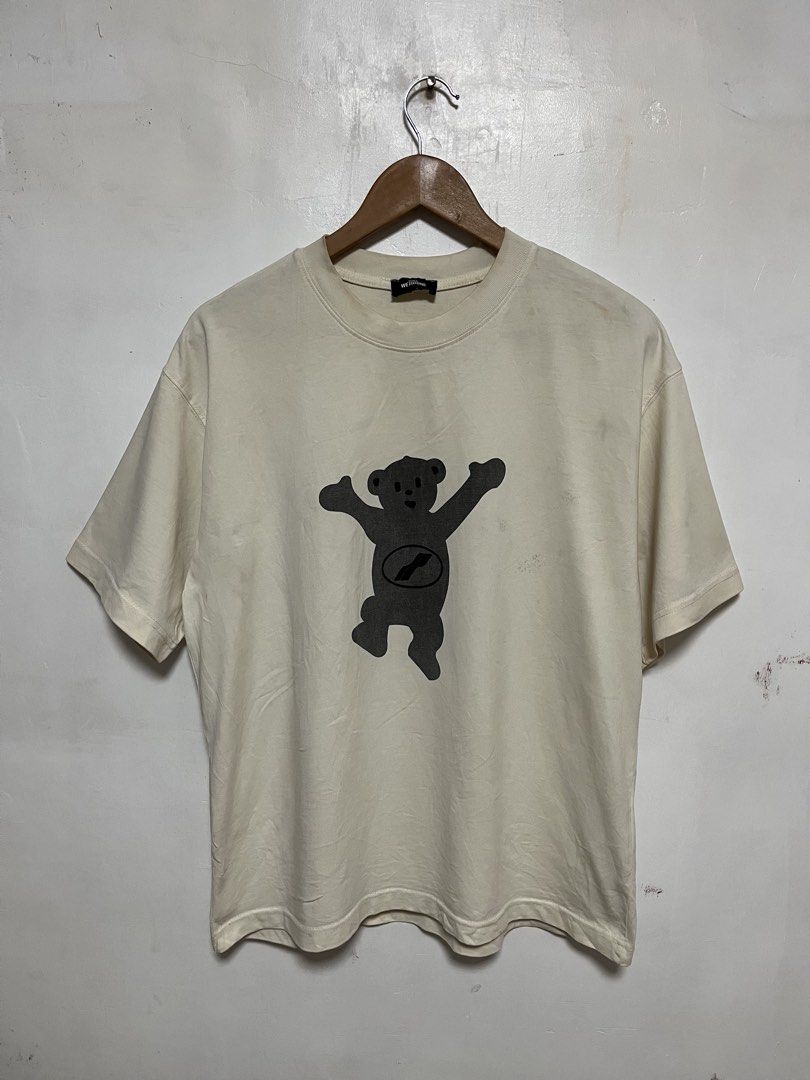 DORA WET1DONE Bear Graphic T-Shirt (Category: Shirts) located in Tanza. Submitted by feliciano4108 (Listing ID 1462300262, Image 1). Description: - Cream colored t-shirt - Features a grey bear graphic on both front and back - DORA WET1DONE branding.