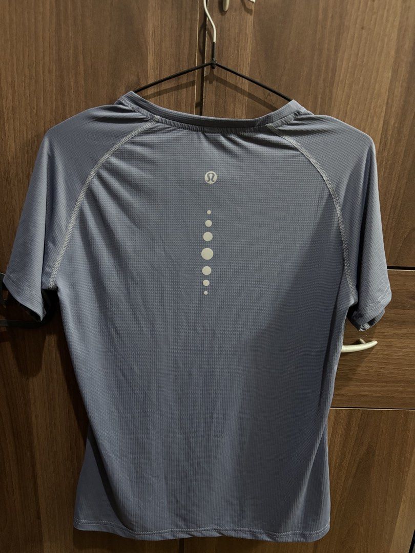 Dri-Fit Workout Shirt (Category: Activewear) located in Taguig. Submitted by wornbypi (Listing ID 1462400105, Image 2). Description: - Color: Periwinkle - Size: XS-S - Fabric: Breathable, comfortable - Features: Reflective dots on the back - Ideal for: Workouts and casual wear ✅ Deliver only via Grab/Angkas/Lalamove within MM ✅ LBC for outside MM (delivery every Wednesday ✅ MOP: gcash, maya ❌ No returns or refunds (aside from exceptional cases).