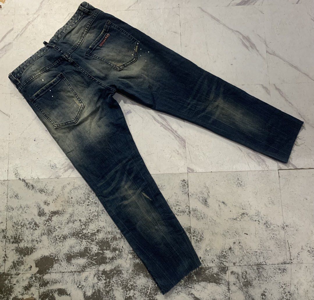 DSQUARED2 Distressed Wash Jeans (Category: Jeans) located in Bacolod City. Submitted by lazythrifts (Listing ID 1462262967, Image 2). Description: - DSQUARED2 jeans - Distressed wash with paint splatters and fading - Button fly closure - Raw hem detail - Perfect for a casual, edgy look - Please check photos for condition details.