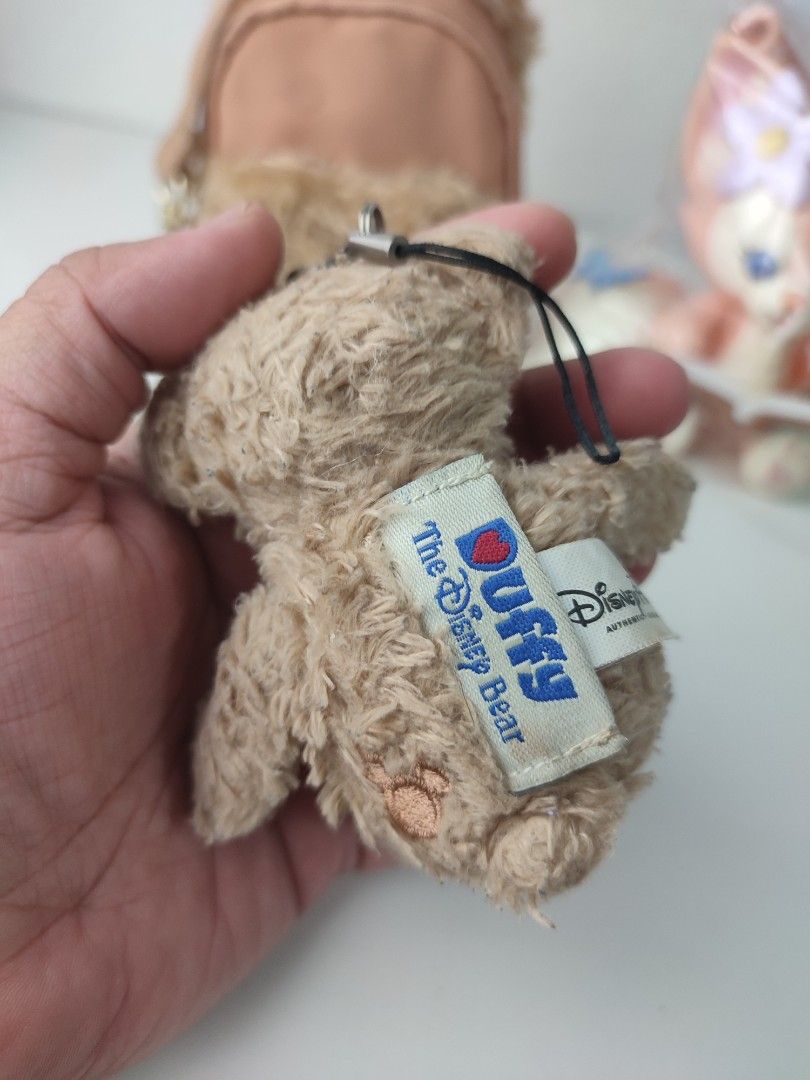 Duffy the Disney Bear Keychain Plush Toy (Category: Plushies & Soft Toys) located in Manila. Submitted by epicmountain-f20453 (Listing ID 1462407466, Image 2). Description: - Cute Duffy the Disney Bear plush keychain - Perfect for attaching to bags or backpacks - Features official Disney tags - Ideal gift for any Disney fan - Small and portable design.