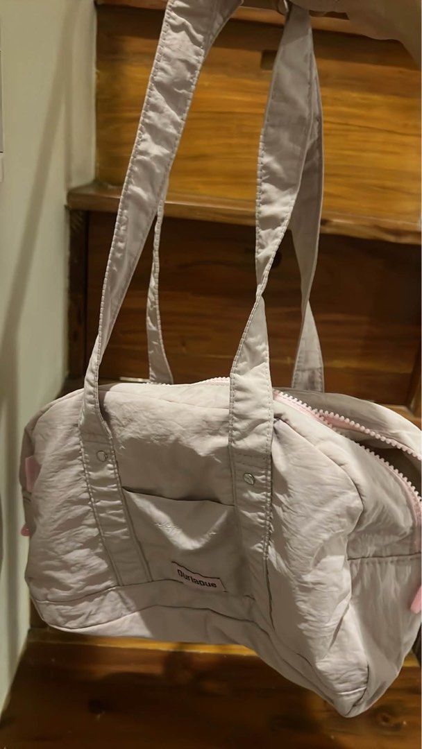 Durlapue Duffle Bag - Light Pink (Category: Luxury Bags & Wallets) located in Bacolod City. Submitted by strawberrymochi1201 (Listing ID 1462439142, Image 1). Description: - Cute duffle bag from Durlapue - Light pink color with pink zipper details - Front pocket for easy access - Spacious interior with an internal pocket - Ideal for gym sessions, weekend trips,school or everyday use - no flaws and fixed price.