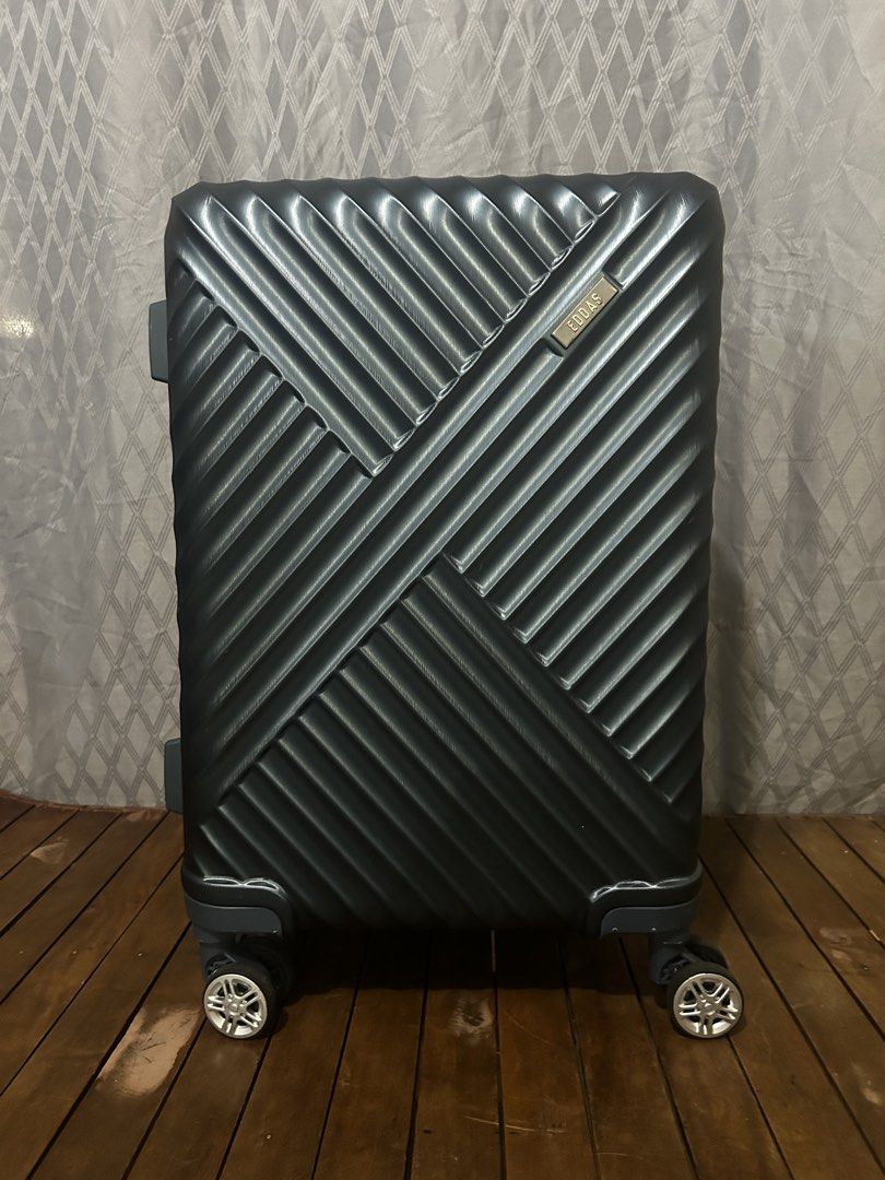 EDDAS Expandable Luggage (Category: Luggage) located in Taguig. Submitted by ghiebow06 (Listing ID 1462377203, Image 1). Description: Dimensions: H- 21 1/2 W- 14 D- 9 (1.5in extra depth) - Dark grey hard shell suitcase - Built-in TSA combination lock for security with key - Smooth rolling spinner wheels for easy maneuverability - Retractable handle for comfortable transport - Spacious interior for all your travel essentials - Durable and stylish 