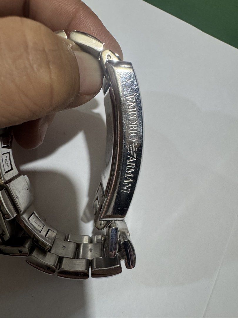 Emporio Armani Ga authentic 100% AR-0145 (Category: Luxury Watches) located in Manila. Submitted by wildbear.e10374 (Listing ID 1462363951, Image 3). Description: - Emporio Armani AR-0145 Watch - 10th Anniversary Edition - Silver Tone with Roman Numerals - Stainless Steel Band - Water Resistant up to 50 Meters - Shows some signs of wear on band and casing - Still a great looking timepiece.