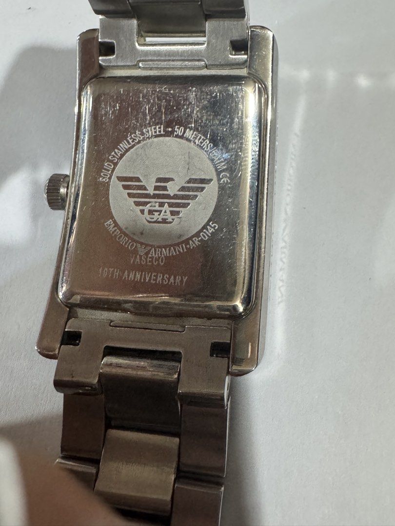 Emporio Armani Ga authentic 100% AR-0145 (Category: Luxury Watches) located in Manila. Submitted by wildbear.e10374 (Listing ID 1462363951, Image 2). Description: - Emporio Armani AR-0145 Watch - 10th Anniversary Edition - Silver Tone with Roman Numerals - Stainless Steel Band - Water Resistant up to 50 Meters - Shows some signs of wear on band and casing - Still a great looking timepiece.