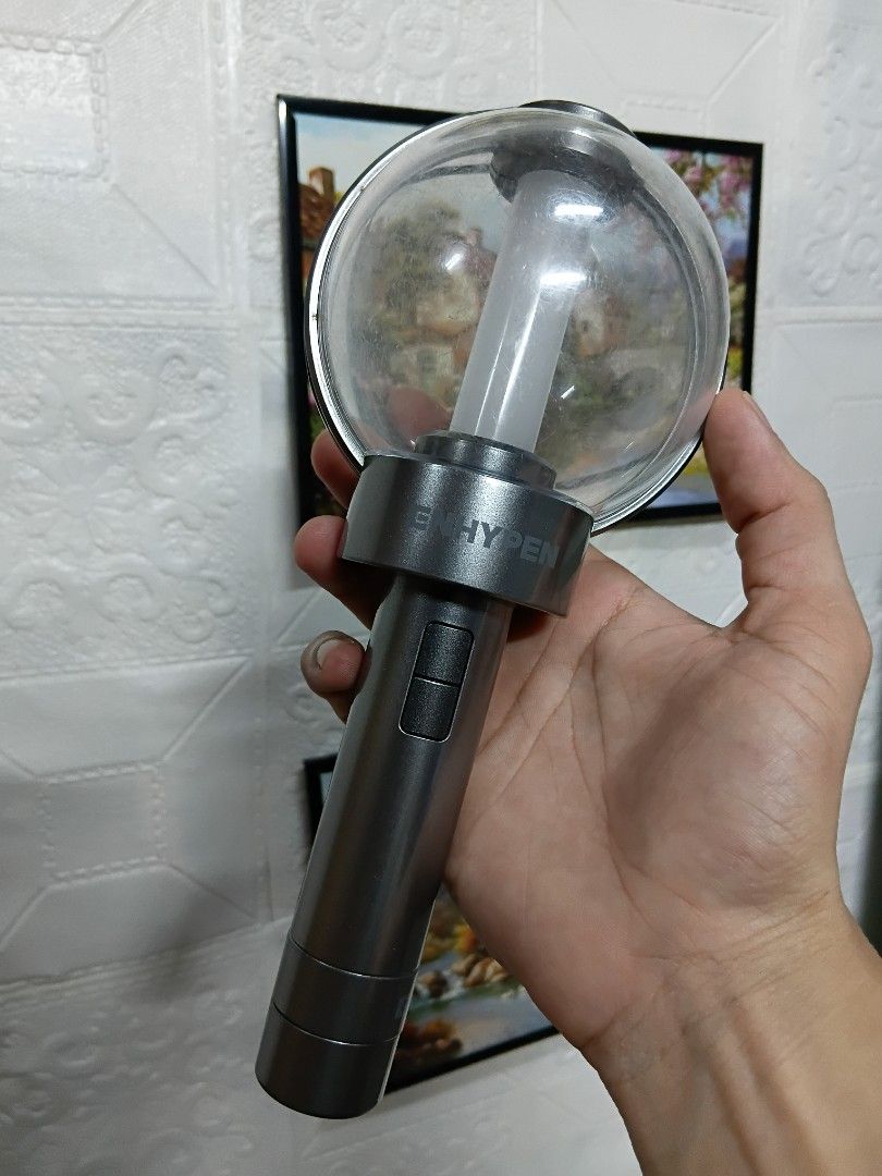 Enhypen Light Stick (Category: Music Accessories) located in Quezon City. Submitted by coffeeyuki56158 (Listing ID 1462314455, Image 1). Description: enhypen light stick may mga scratches na po expect from a 2nd hand po , gumagana pa yung lights and working buttons nya kaya lang medyo loose na yung sa battery part na lagayan kaya minsan namamatay ang ilaw or doesn't light at all kailangan medyo mahigpit ang pag kakalagay ng takip to make it work 