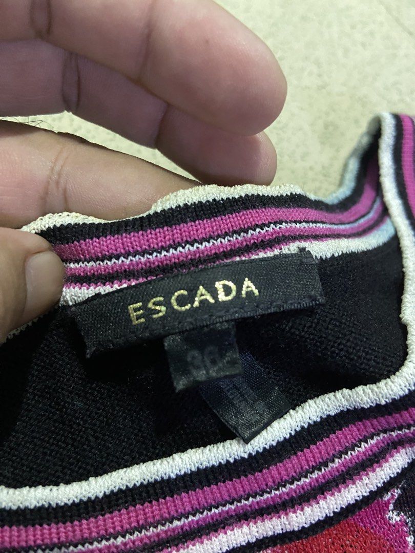 Escada Graffiti Print Knit T-shirt (Category: Shirts) located in Bulacan. Submitted by rrthrifts (Listing ID 1462353818, Image 3). Description: - Brand: Escada - Item: Knit Tee - Size: 36 - Design: Vibrant graffiti print - Details: Black sleeves and trim with pink and white stripes - Style: Unique, bold, casual.