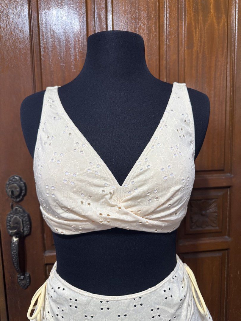 Eyelet Bikini Set with Ruffled Skirt - Size M (Category: Bikinis & Swimsuits) located in Manila. Submitted by prelovedshopmnl (Listing ID 1462275671, Image 2). Description: - Light yellow eyelet bikini set - Twisted front top - Ruffled tiered skirt - High-waisted bottoms - Material: 95% polyester, 5% elastane - Ideal for beach days and pool parties - Comfortable and stylish design.