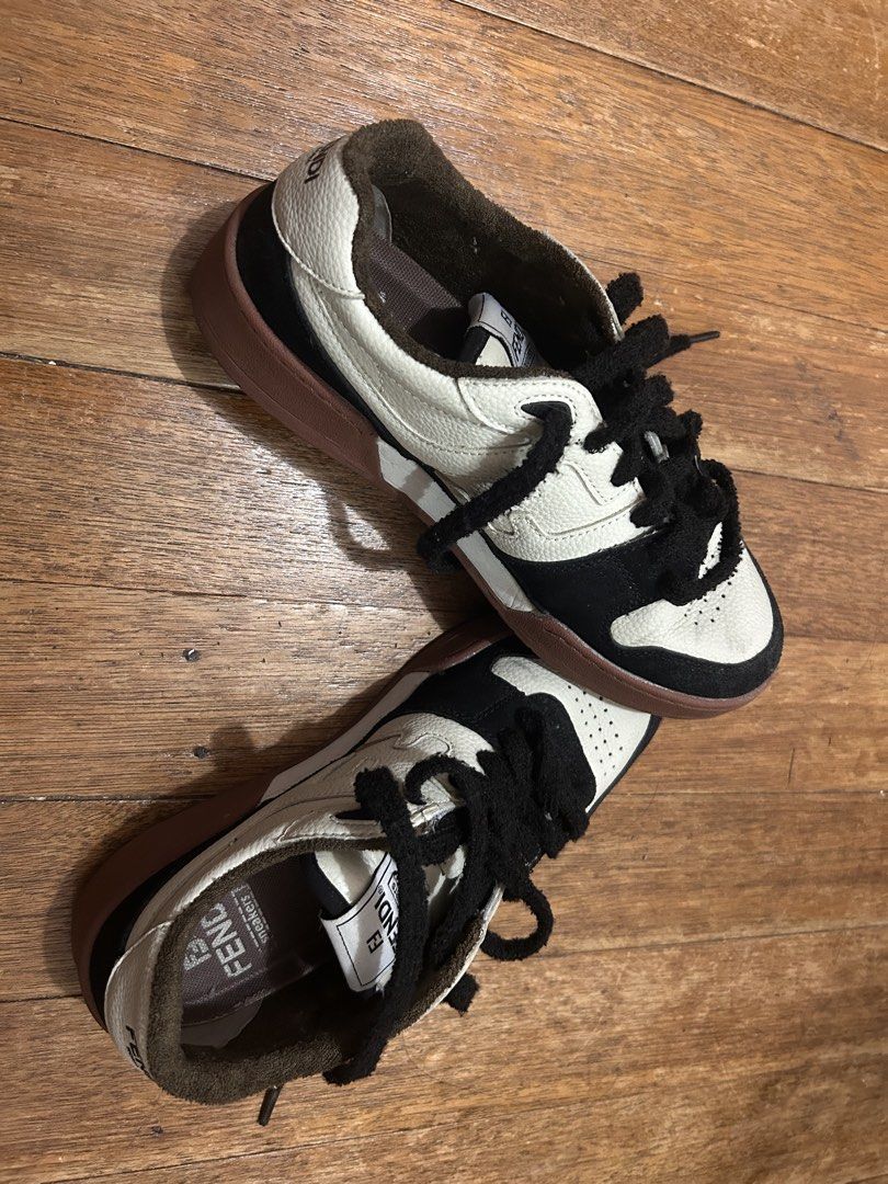 Fendi Sneakers (Category: Sneakers) located in Manila. Submitted by kayjeee (Listing ID 1462306926, Image 1). Description: - Fendi sneakers - Classic black and white colorway - Distinctive brown sole - Secure lace-up closure - Designed for everyday comfort.
