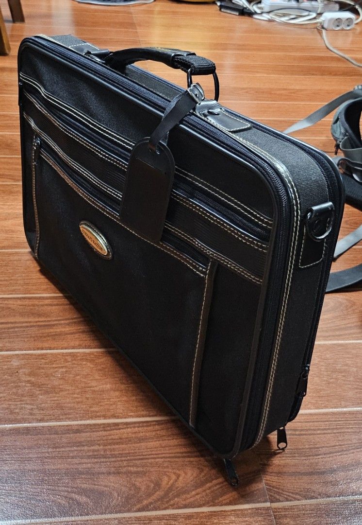 FERNAND RAZZINI Black Business Bag (Category: Briefcases) located in Cavite. Submitted by sunghanphil_31 (Listing ID 1462278721, Image 1). Description: - Brand: FERNAND RAZZINI - Color: Black - Features: Multiple interior compartments for organization - Ideal for: Work or travel - Condition: Good overall shape with minor exterior scuffs - Functionality: Zippers work well, sturdy handle - Includes: Luggage tag.