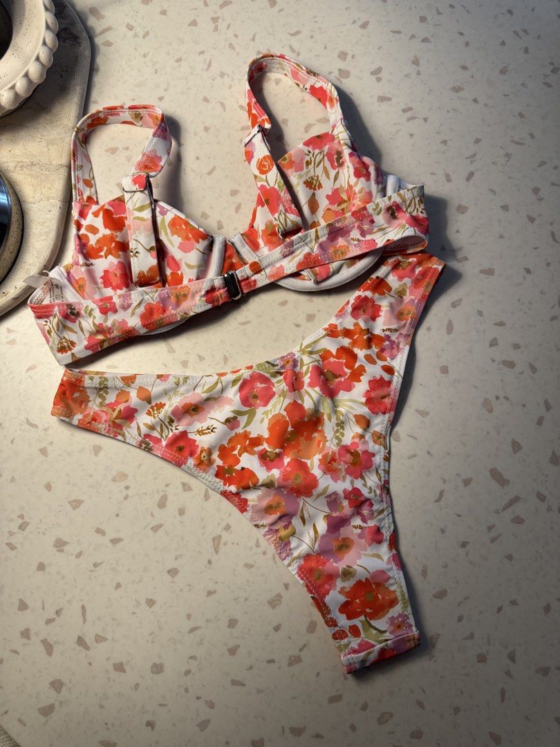 Floral Print Bikini Set - Pink, Orange, White (Category: Bikinis & Swimsuits) located in Las Pinas. Submitted by patringcia_14 (Listing ID 1462317258, Image 3). Description: - Adorable floral print bikini set - Push-up style top with adjustable straps - Matching high-cut bottoms - Vibrant colors and fun pattern - Ideal for beach days and pool parties.