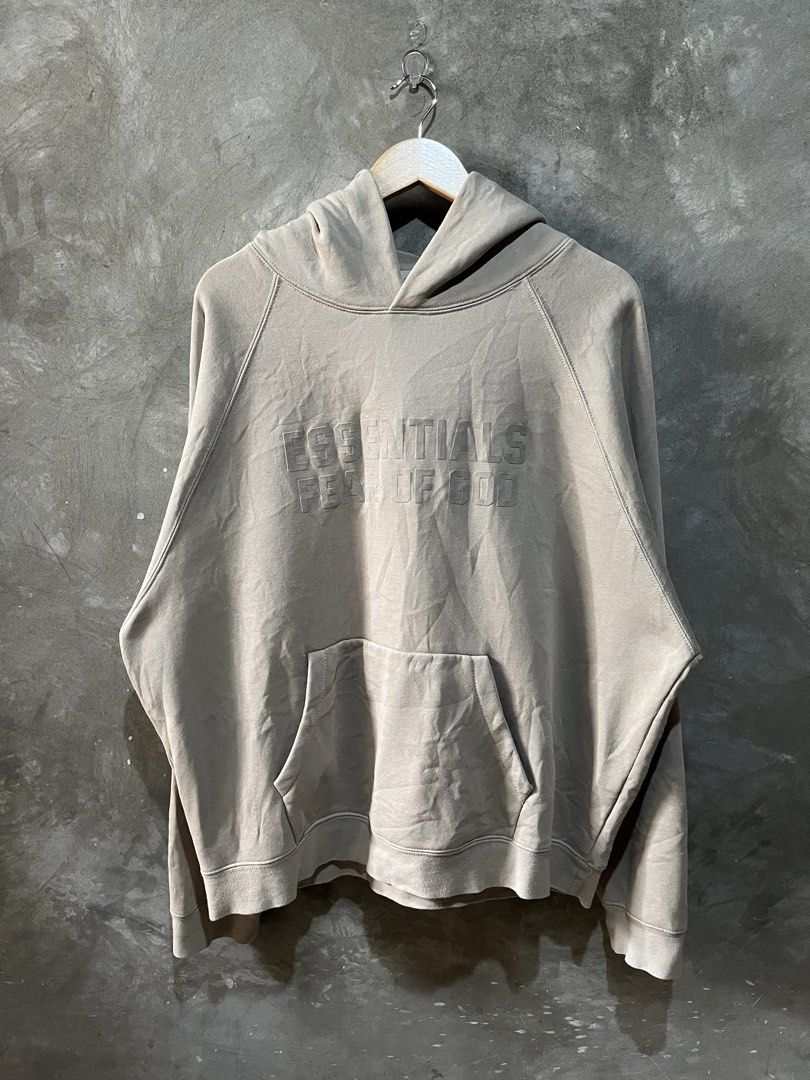 FOG Essentials hoodie (Category: Activewear) located in Manila. Submitted by thriftnirogus (Listing ID 1462373394, Image 1). Description: Beige Fear Of God Essentials pullover Hoodie Width: 26 Length: 28 excellent condition no issue.