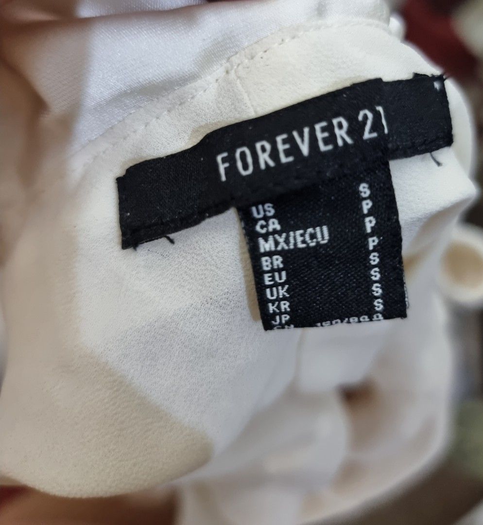 Forever 21 Off Shoulder Ruffle Satin Dress (Category: Dresses) located in Quezon City. Submitted by thriftislayp (Listing ID 1462316713, Image 3). Description: ♡ White off-the-shoulder mini dress featuring a ruffled overlay neckline and long side sleeves. ♡ Satin material ♡ Mini length ♡ Fits sizes XS to M ₱300 negotiable.