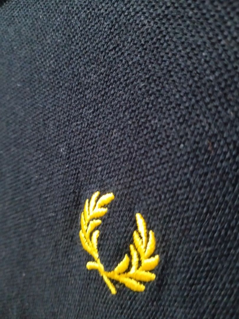 Fred Perry Polo Shirt Black Yellow Trim Size M (Category: Tshirts & Polo Shirts ) located in Quezon City. Submitted by j_tino_ishi260 (Listing ID 1462418521, Image 3). Description: - Classic Fred Perry polo shirt - Navy blue with yellow collar and sleeve trim - Iconic embroidered laurel wreath logo on chest - Size: Medium (M) - Made in China - Perfect for casual wear.