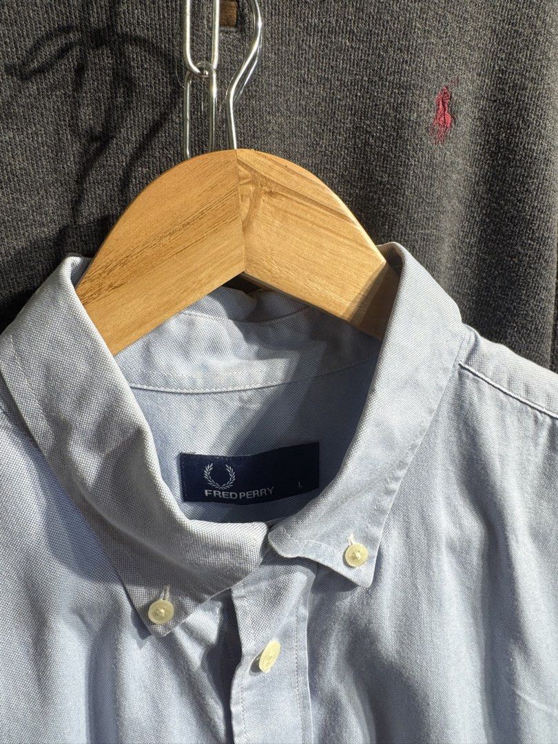 Fred Perry Short Sleeve Button Up Shirt Light Blue (Category: Tshirts & Polo Shirts ) located in San Jose. Submitted by strictlyRL (Listing ID 1462365792, Image 3). Description: - Brand: Fred Perry - Color: Light Blue - Sleeve Length: Short Sleeve - Style: Button-up Shirt - Collar: Button-down - Features: Embroidered classic laurel wreath logo on chest pocket - Size: L - Occasion: Casual wear, smart casual outfits 22-22.5 width 28 length (inches)