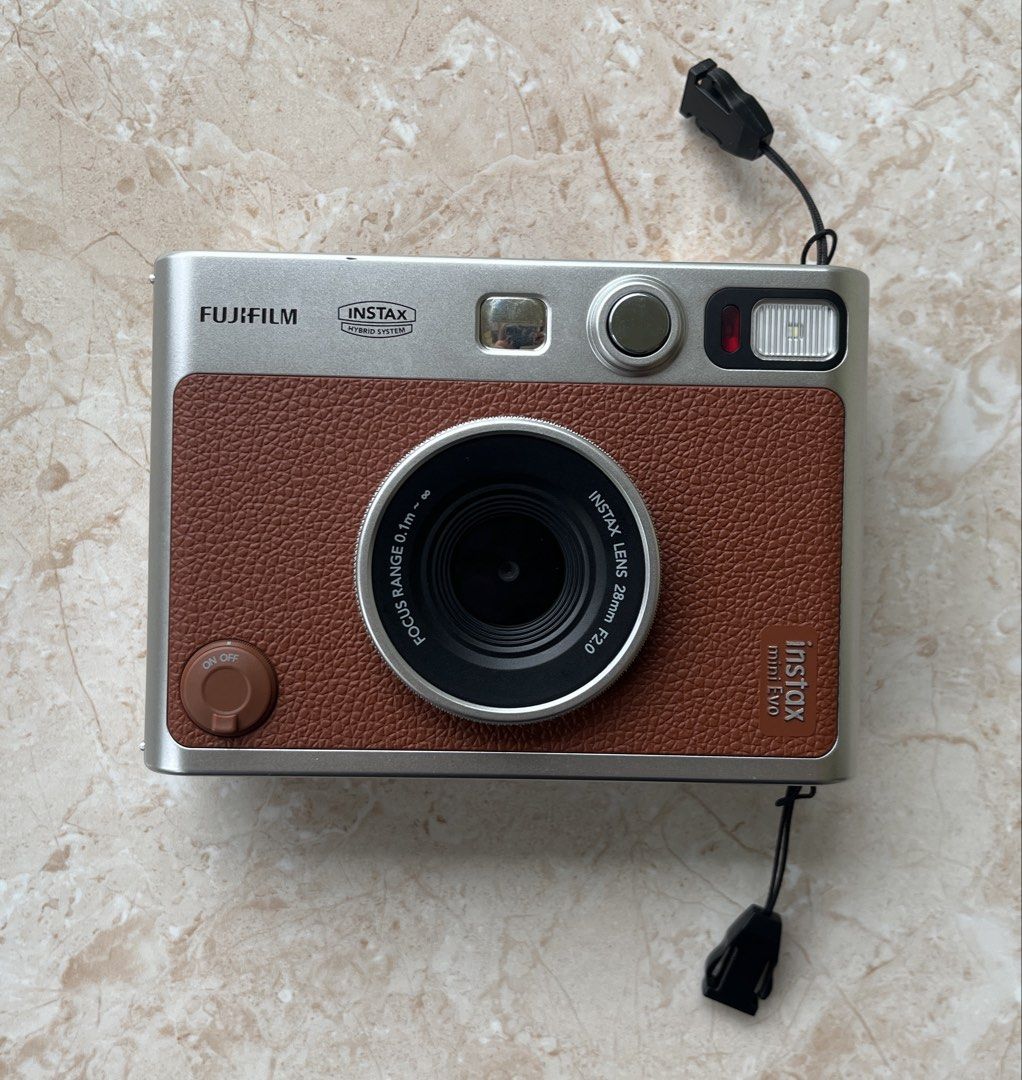 Fujifilm Instax Mini EVO Instant Film Camera (2023 Version) (Category: Cameras) located in Davao. Submitted by 0411carts (Listing ID 1462284868, Image 1). Description: I don’t use it much, nakatambak lang siya dito. Good as new. Inclusions: Leather Bag, will also include some Instax Films (Plain, Contact Sheet, Black).