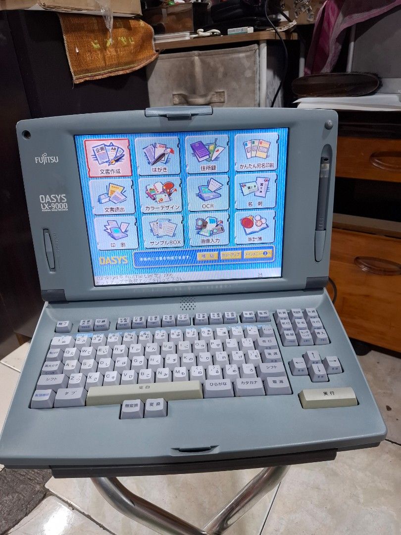 Fujitsu OASYS LX-9000 Portable Word Processor (Category: Laptops & Notebooks) located in Santa Rosa. Submitted by echojapansurplus_01 (Listing ID 1462401952, Image 3). Description: - Vintage Fujitsu OASYS LX-9000 word processor - Portable unit with integrated keyboard and screen - Features Japanese characters on keys and interface - Displays document and editing functions - Power adapter not shown, but likely required - Ideal for collectors or fa