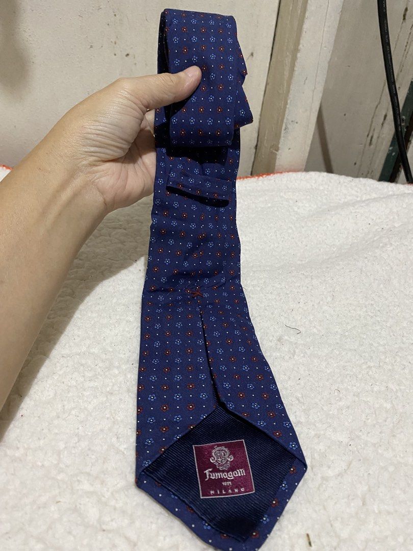 Fumagalli 1891 Milano Silk Tie (Category: Ties) located in Manila. Submitted by resi.diaz (Listing ID 1462367958, Image 3). Description: - Classic navy tie with a subtle red and blue floral pattern. - Made in Italy by Fumagalli. - Approximately 57 inches long. - Ideal for formal or business attire. - Adds a stylish pop of color to your look..