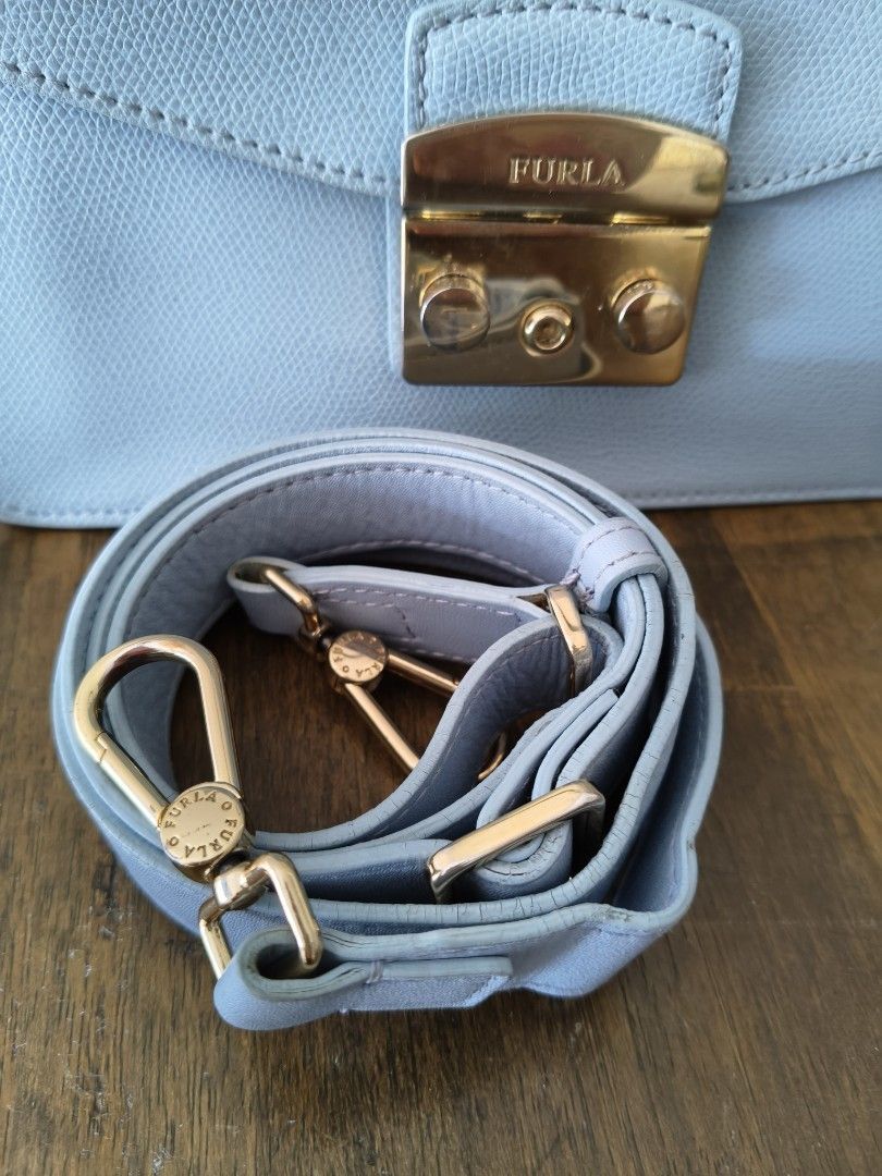 🩵Furla Metropolis Top Handle Mini Bag Light Blue (Category: Luxury Bags & Wallets) located in Tarlac. Submitted by momma02 (Listing ID 1462289701, Image 2). Description: - Light blue Furla Metropolis mini bag Made of saffiano leather. The bag features a push lock closure that opens to fabric lining with interior one slip pocket. -negiotiable, pls send reasonable offer Details: 23 x 8 x 17 Cm Gold tone hardware Saffiano leather Push lock closure 
