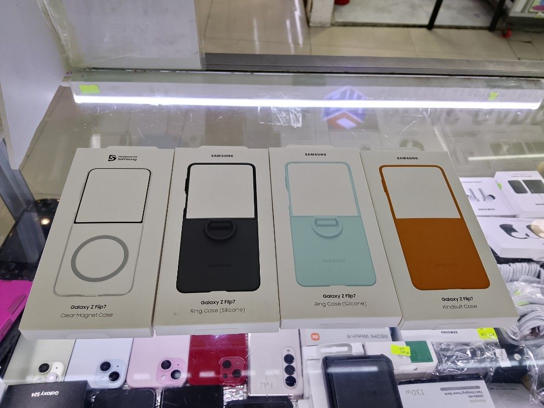 Galaxy Flip 7 Case 1500-1600 (Category: Cases & Sleeves) located in Manila. Submitted by cettipreloved (Listing ID 1462300630, Image 1). Description: - Official Samsung cases for Galaxy Z Flip 7. - Available styles: Clear Magnet Case, Ring Case (Silicone), Kindsuit Case. - Colors: Clear, Black, Mint Green, Orange/Tan. - Clear Magnet Case offers MagSafe compatibility. - Ring Case provides enhanced grip and kickstand functionality. - Kindsuit Case 