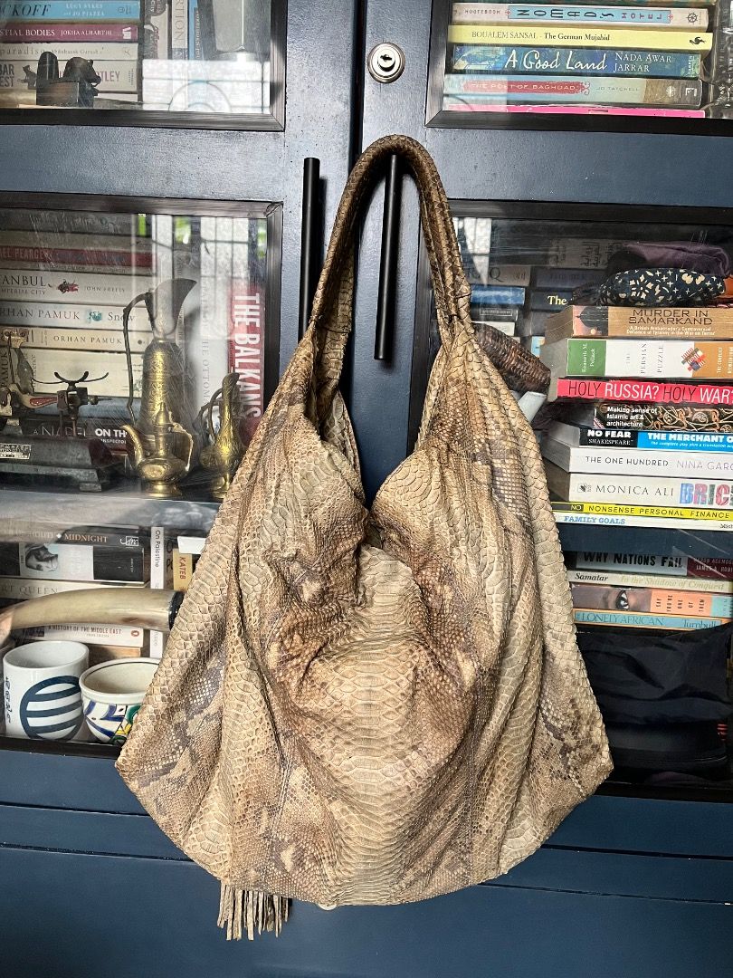 Genuine snakeskin bag (Category: Shoulder Bags) located in Makati City. Submitted by Ina_Ndang (Listing ID 1462284036, Image 1). Description: - preloved hobo style bag; can fit laptop and other essentials - color is grayish/bluish/brown - black velvety-type lining - genuine snakeskin FLAWS: - ripped (natastas na tahi) interior pocket; does not affect functionality; can be sewn - torn (napunit) skin near the metal ring or handle attachment - bag h