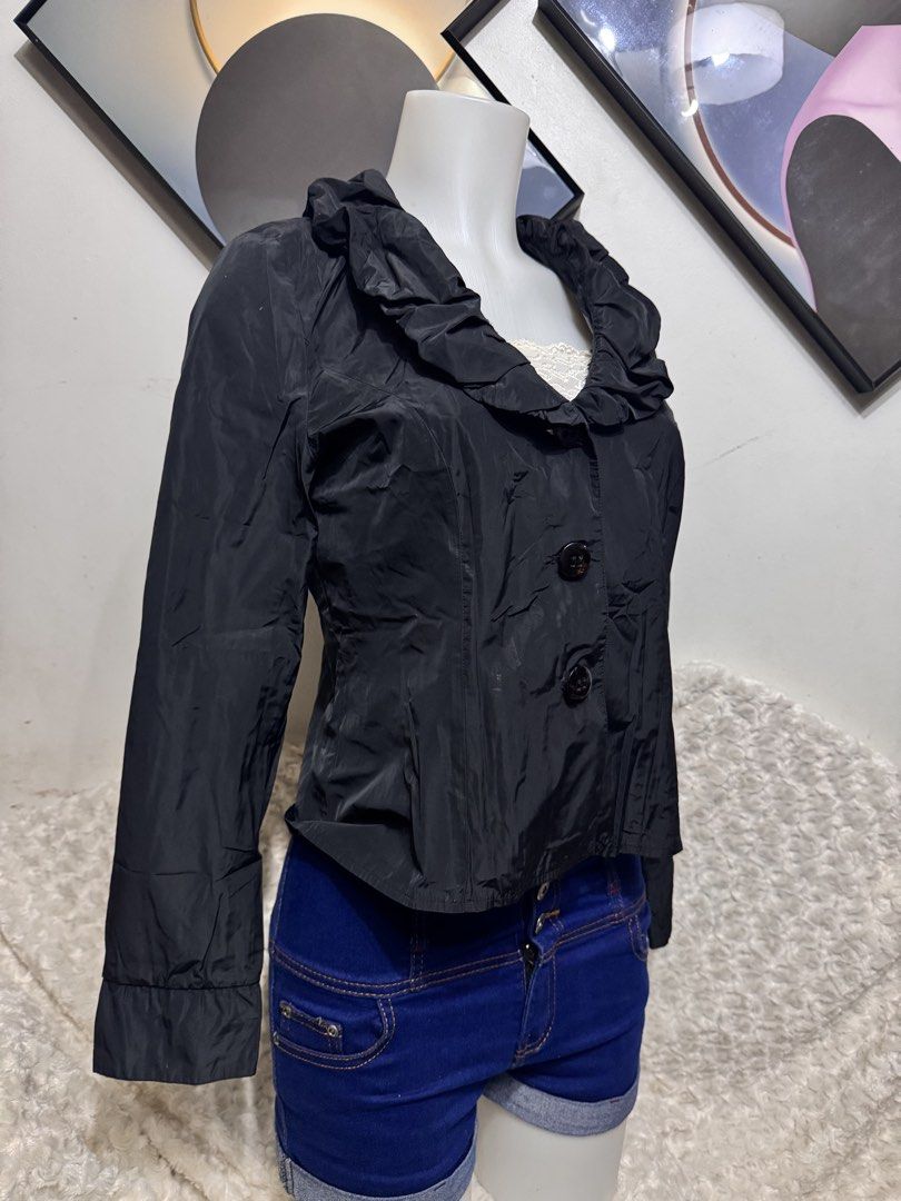 Gerry Weber Edition Black Ruffled Collar Jacket (Category: Coats, Jackets and Outerwear) located in Marikina City. Submitted by lorradel (Listing ID 1462326326, Image 2). Description: - fits S-M - Gerry Weber Edition black thin jacket - Features a ruffled collar - Button-up front - Long sleeves with buttoned cuffs - Lightweight material - Ideal for smart casual layering - MAY HAVE some washable stains (hindi maiiwasan) needs washing; had been sto