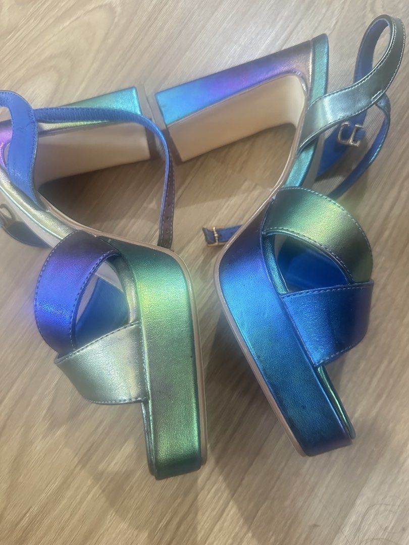 GIBI Iridescent Platform Block Heels Size 38 (Category: Heels) located in Makati City. Submitted by maria_k_tan (Listing ID 1462265934, Image 2). Description: - Brand: GIBI - Style: Platform Heels - Color: Iridescent (blue, green, purple tones) - Features: Strappy design, ankle buckle - Size: 38 - Occasion: Great for dressing up any outfit Never really used. I bought it for a wedding but decided to go with something else Box still available .