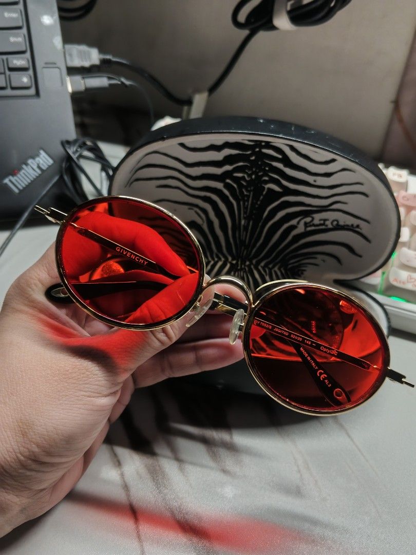 Givenchy GV 7052/S Sunglasses (Category: Sunglasses & Eyewear) located in Paranaque City. Submitted by maeserrano23 (Listing ID 1462401065, Image 3). Description: Authentic Givenchy GV 7052/S Gold Metal & Red Tinted Oval Sunglasses ‎ ‎Price: 6,500 ‎ ‎Selling this gorgeous, authentic Givenchy eyewear. Super trendy and perfect for street style, Y2K retro fashion, or everyday awra! ‎ ‎✨ FEATURES & DETAILS: ‎ ‎Model: Givenchy GV 7052/S ‎ ‎Design: Sle