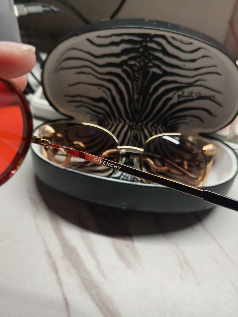 Givenchy GV 7052/S Sunglasses (Category: Sunglasses & Eyewear) located in Paranaque City. Submitted by maeserrano23 (Listing ID 1462401065, Image 2). Description: Authentic Givenchy GV 7052/S Gold Metal & Red Tinted Oval Sunglasses ‎ ‎Price: 6,500 ‎ ‎Selling this gorgeous, authentic Givenchy eyewear. Super trendy and perfect for street style, Y2K retro fashion, or everyday awra! ‎ ‎✨ FEATURES & DETAILS: ‎ ‎Model: Givenchy GV 7052/S ‎ ‎Design: Sle
