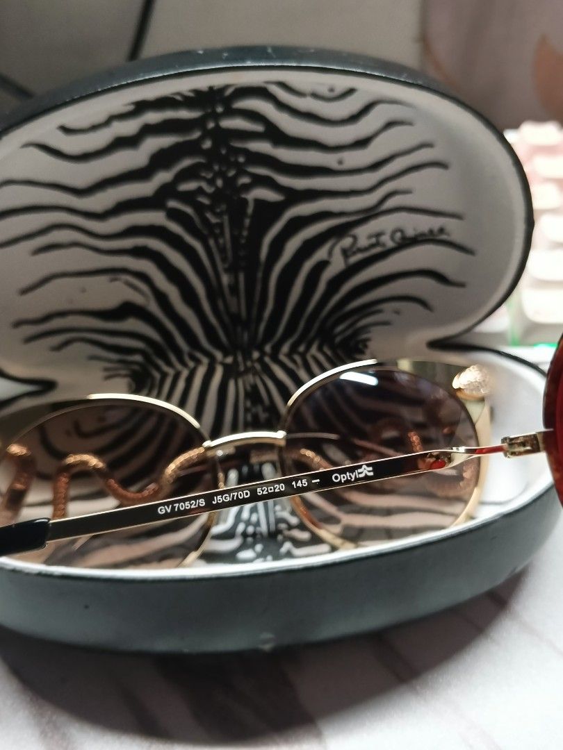 Givenchy GV 7052/S Sunglasses (Category: Sunglasses & Eyewear) located in Paranaque City. Submitted by maeserrano23 (Listing ID 1462401065, Image 1). Description: Authentic Givenchy GV 7052/S Gold Metal & Red Tinted Oval Sunglasses ‎ ‎Price: 6,500 ‎ ‎Selling this gorgeous, authentic Givenchy eyewear. Super trendy and perfect for street style, Y2K retro fashion, or everyday awra! ‎ ‎✨ FEATURES & DETAILS: ‎ ‎Model: Givenchy GV 7052/S ‎ ‎Design: Sle