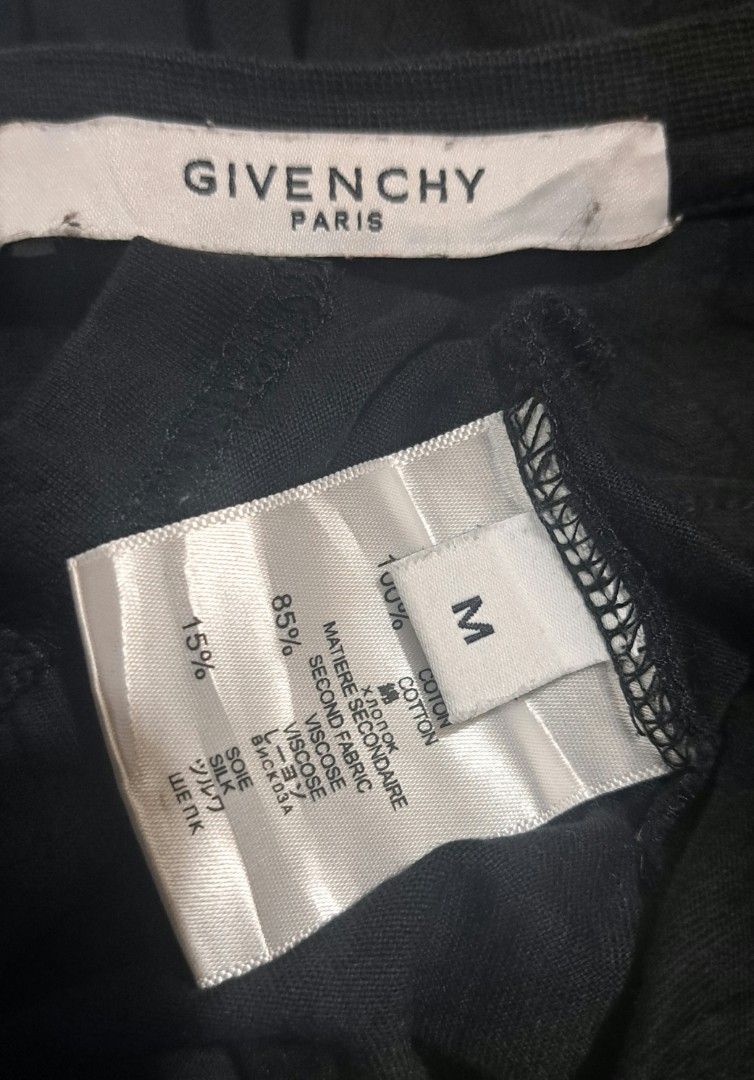 Givenchy Paris Shark Print T-Shirt Size M (Category: Tshirts & Polo Shirts ) located in San Fernando, Camarines Sur. Submitted by ladderaya (Listing ID 1462323485, Image 2). Description: - Givenchy Paris T-Shirt - Color: Black - Iconic Shark Graphic Print - Size: Medium (M) - Material: 100% Cotton - Secondary Fabric: Viscose & Silk - Origin: Made in Portugal - Perfect addition to any fashion collection.