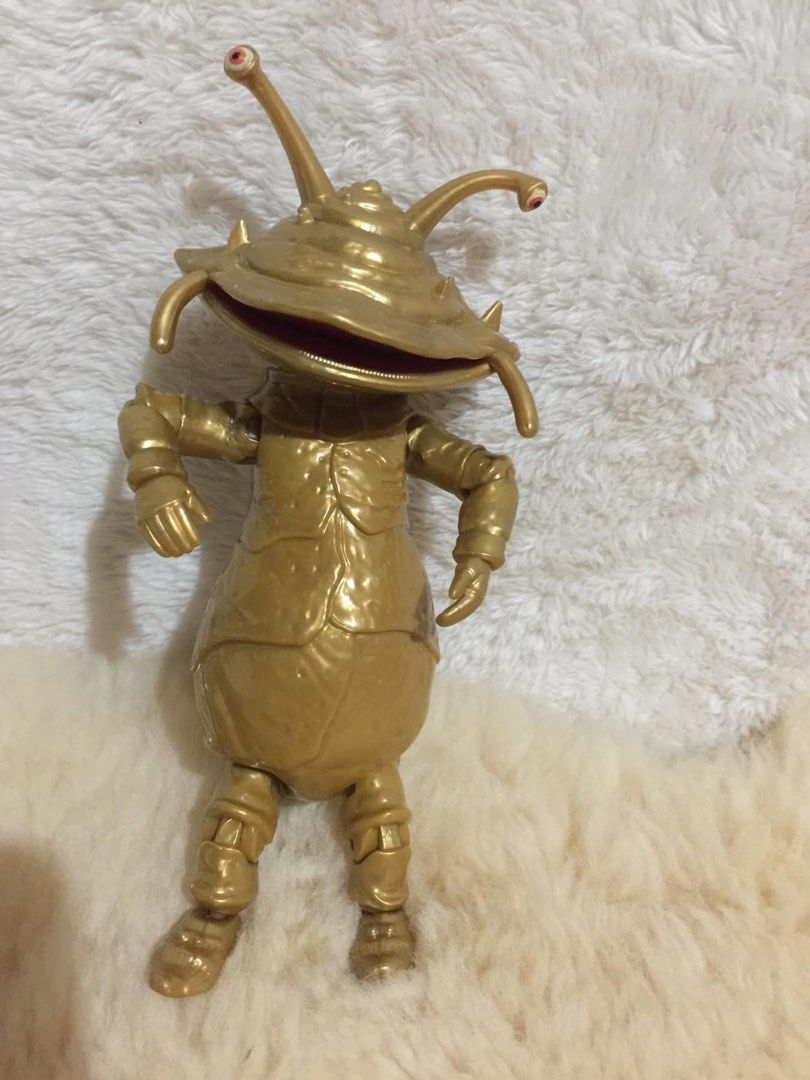 Gold Alien Insectoid Action Figure Toy (Category: Figurines & Statues) located in Baguio. Submitted by izza_thrifty (Listing ID 1462436860, Image 1). Description: - Unique gold alien insectoid action figure - Stands independently - Features articulated joints for dynamic posing - Approximately the size of a soda can - Ideal for collectors and display purposes.