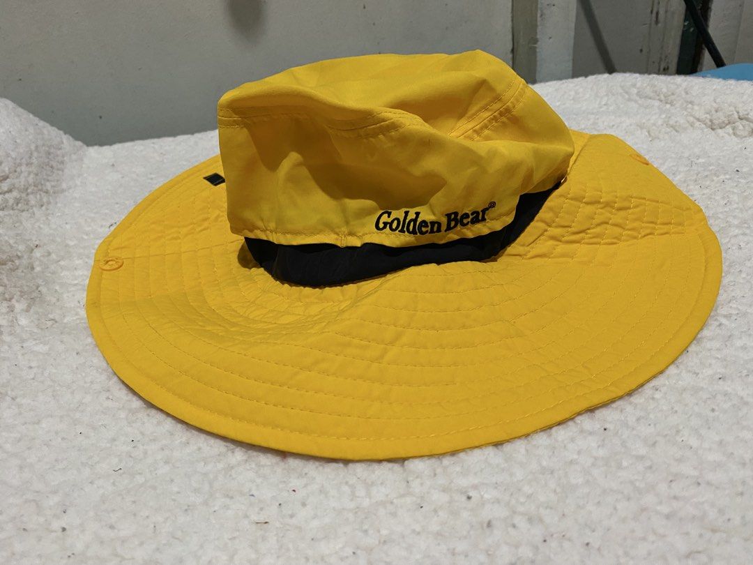 Golden Bear Yellow Golf Bucket Hat (Category: Hats & Beanies) located in Manila. Submitted by resi.diaz (Listing ID 1462428308, Image 1). Description: - Yellow bucket hat from Golden Bear - 'GOLF' printed on the brim - Adjustable chin strap for a secure fit - Mesh lining inside for enhanced breathability - Ideal for outdoor activities and sunny weather.