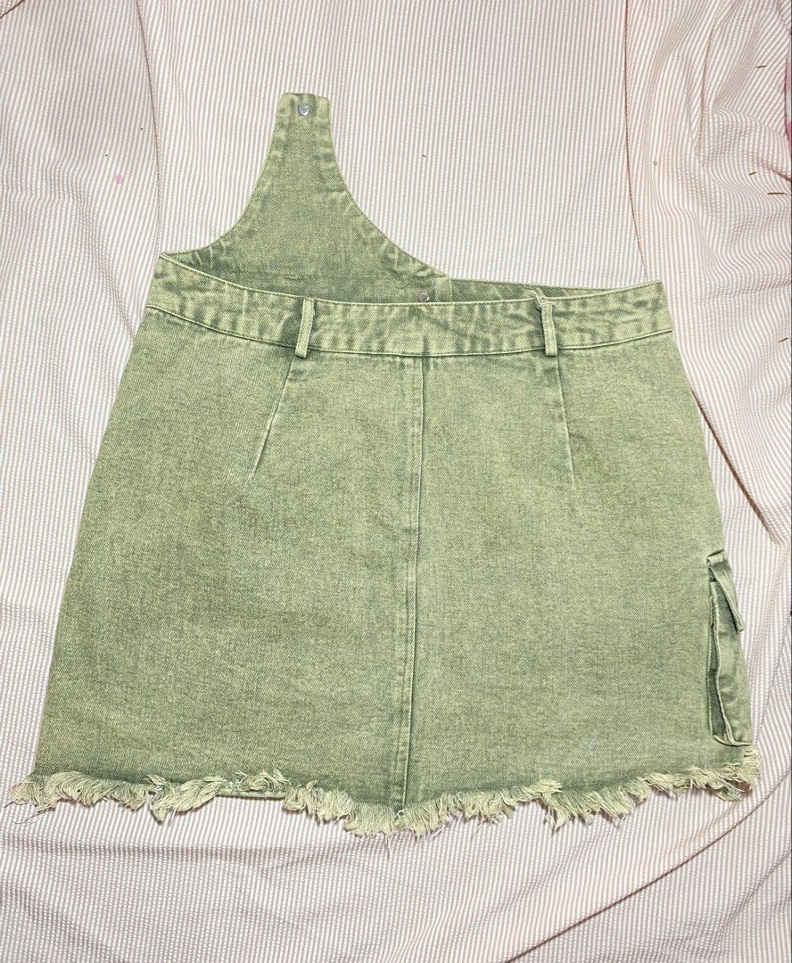 Green Denim Cargo Skirt with Asymmetrical Strap (Category: Skirts) located in Paranaque City. Submitted by golden_jinkay (Listing ID 1462422296, Image 2). Description: -Waist:30-32 -Lenght:16 - Cool brown denim skirt - Features a side cargo pocket - Edgy frayed hem - Unique asymmetrical strap detail - Secure button and zip closure - Belt loops for customization - Estimated size: 30-32.