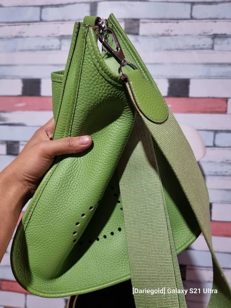 Green Leather Handbag with Adjustable Strap (Category: Shoulder Bags) located in Baguio. Submitted by msgold2601 (Listing ID 1462366034, Image 2). Description: - Stylish green leather handbag - Unique textured finish with perforated detail - Includes a matching adjustable strap - Luxurious suede-like interior - Interior stamp reads '1787' - Ideal for everyday wear.