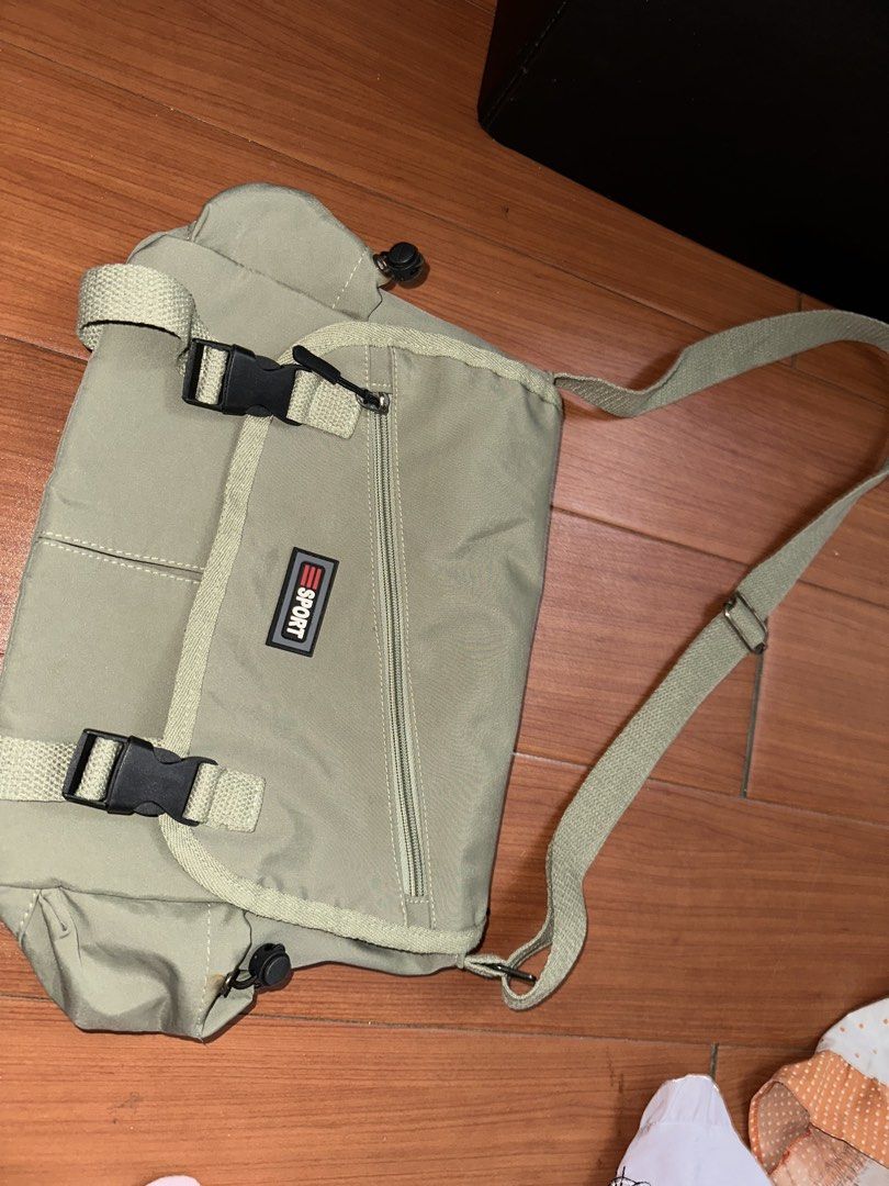 Green Messenger Bag (Category: Cross-body Bags) located in Manila. Submitted by itemsbykeiko (Listing ID 1462387993, Image 1). Description: kalawang sa mga silver hardware but barely noticeable.