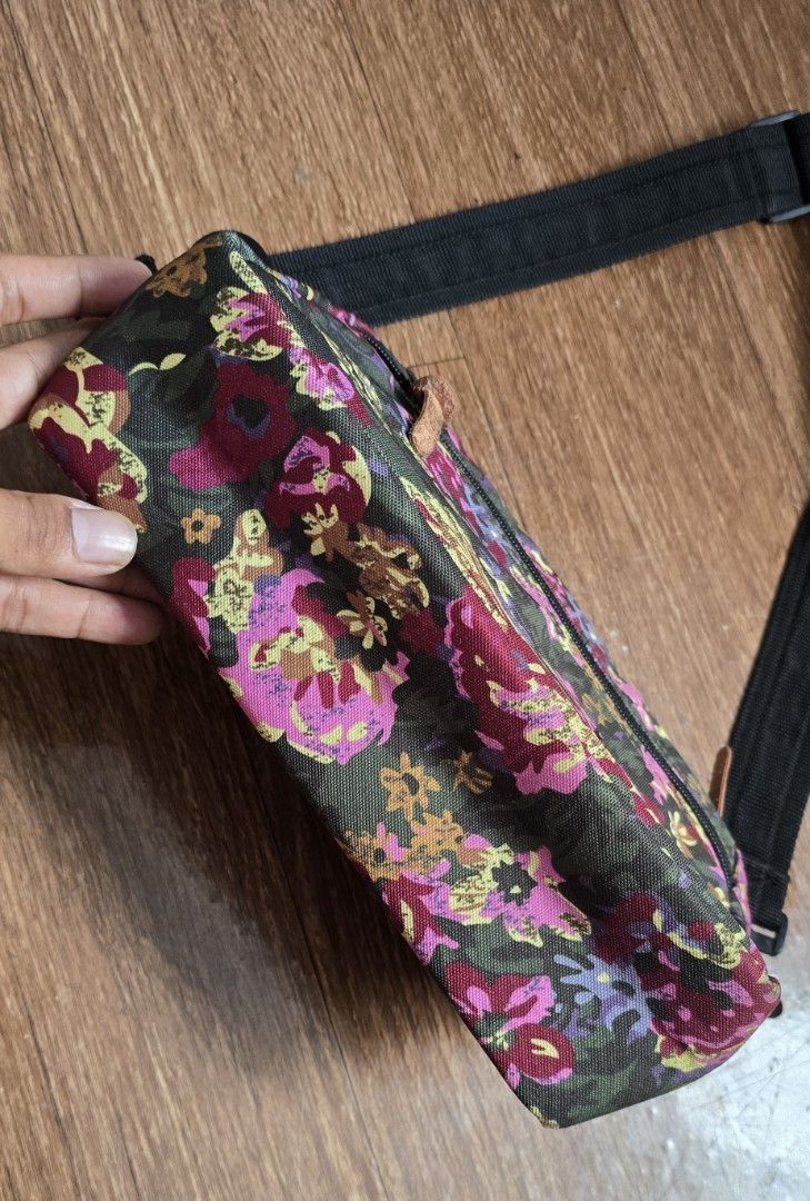 Gregory Floral Crossbody Bag (Category: Cross-body Bags) located in Quezon. Submitted by archivesss_666 (Listing ID 1462372737, Image 3). Description: - Gregory crossbody bag with a vibrant floral print. - Main zippered compartment for secure storage. - Additional front zippered pocket for quick access. - Adjustable strap for a customized, comfortable fit. - Ideal for everyday errands or travel adventures. - Please note: Leather zipper pulls show
