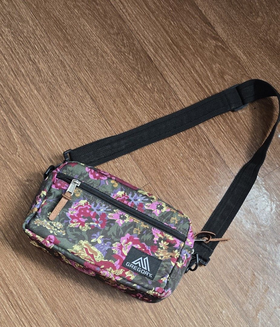 Gregory Floral Crossbody Bag (Category: Cross-body Bags) located in Quezon. Submitted by archivesss_666 (Listing ID 1462372737, Image 1). Description: - Gregory crossbody bag with a vibrant floral print. - Main zippered compartment for secure storage. - Additional front zippered pocket for quick access. - Adjustable strap for a customized, comfortable fit. - Ideal for everyday errands or travel adventures. - Please note: Leather zipper pulls show