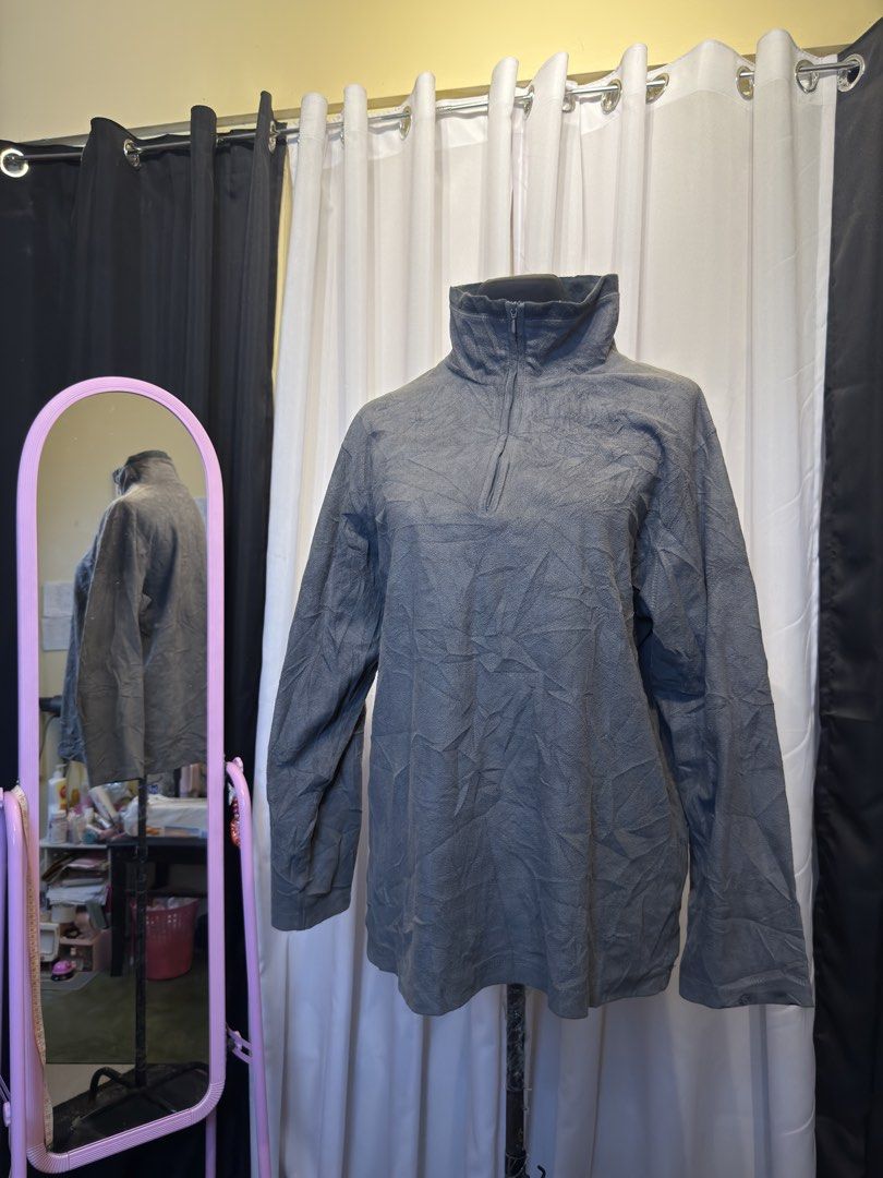 Grey Fleece Pullover with Zipper Neck (Category: Coats, Jackets and Outerwear) located in Pulilan. Submitted by _sevegn (Listing ID 1462305202, Image 1). Description: - Grey long-sleeved fleece pullover - Textured fabric - Quarter-zip neckline for adjustable warmth - Ideal for layering or standalone wear - Comfortable and casual style - Perfect for cooler weather.