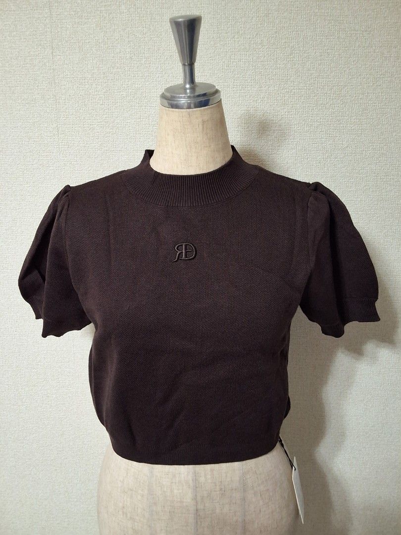 GRL Logo embroidered half-sleeve short knit top (Category: Blouses) located in Santa Rosa. Submitted by bellesdreamph (Listing ID 1462437549, Image 2). Description: GRL Logo embroidered half-sleeve short knit top This top is made from a soft knit fabric for a comfortable fit. The moderately high neckline adds an elegant touch. While basic in design, the logo embroidery on the chest gives it a sophisticated look. The short length slims the overall