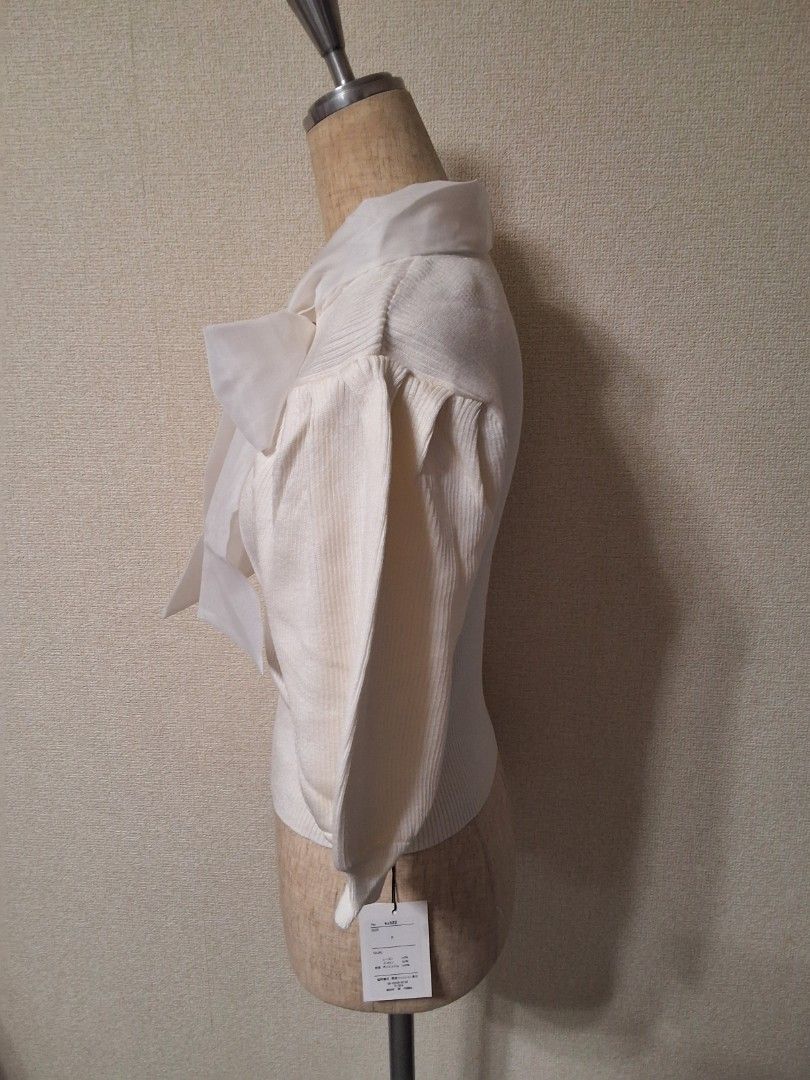 GRL Organza bow tie knit top (Category: Blouses) located in Santa Rosa. Submitted by bellesdreamph (Listing ID 1462437873, Image 3). Description: GRL Organza bow tie knit top This bow-tie knit top features eye-catching, three-dimensional organza ribbons. The puffy sleeves add an extra touch of sweetness. The lightweight knit fabric fits comfortably to the body, creating a feminine silhouette. This item instantly adds a feminine touch to any outfi