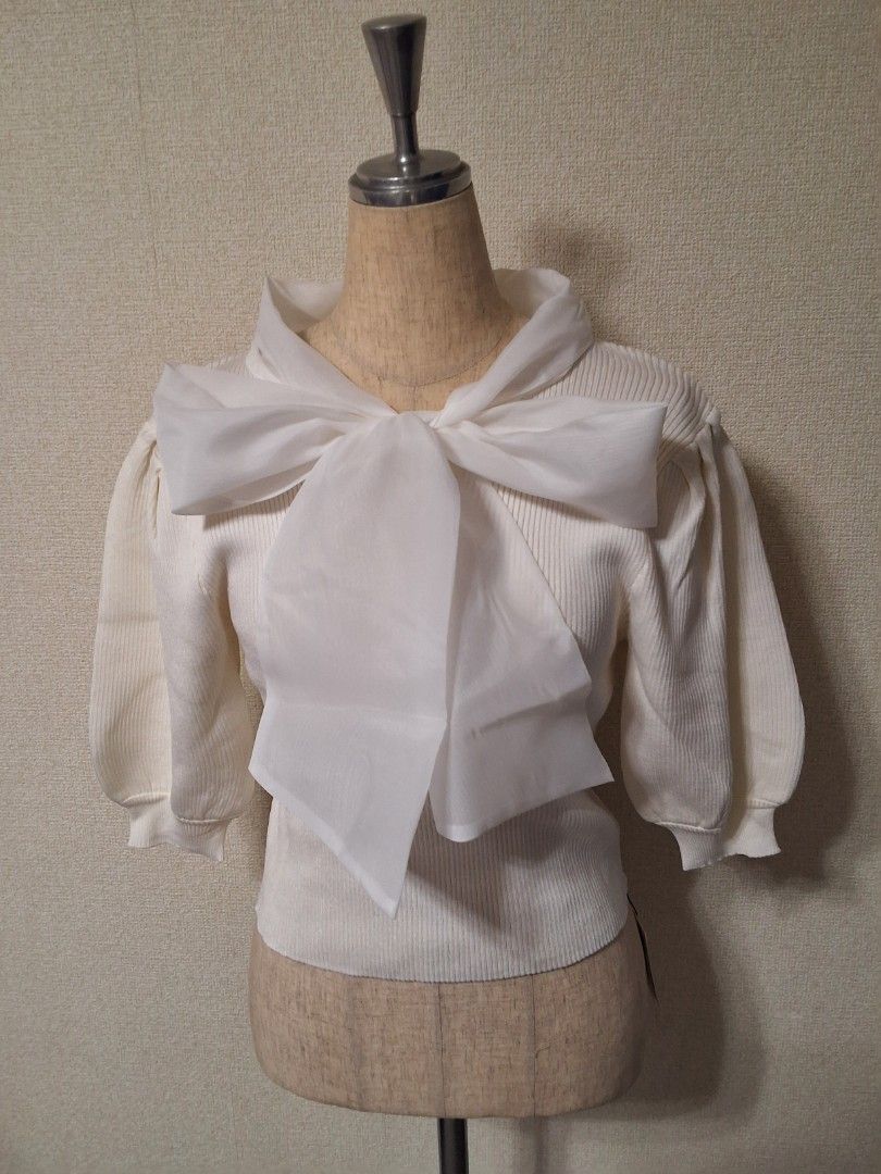 GRL Organza bow tie knit top (Category: Blouses) located in Santa Rosa. Submitted by bellesdreamph (Listing ID 1462437873, Image 2). Description: GRL Organza bow tie knit top This bow-tie knit top features eye-catching, three-dimensional organza ribbons. The puffy sleeves add an extra touch of sweetness. The lightweight knit fabric fits comfortably to the body, creating a feminine silhouette. This item instantly adds a feminine touch to any outfi