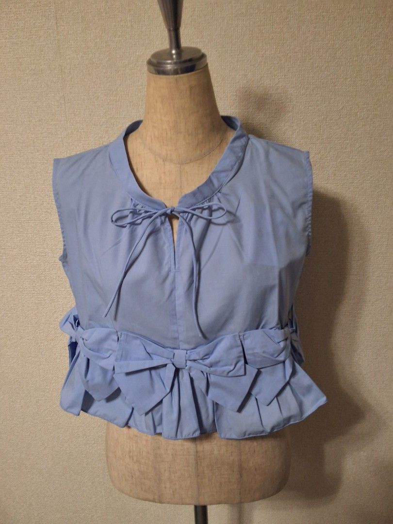 GRL Ribbon frill sleeveless blouse (Category: Blouses) located in Santa Rosa. Submitted by bellesdreamph (Listing ID 1462433899, Image 2). Description: GRL Ribbon frill sleeveless blouse This refreshing sleeveless blouse is perfect for spring and summer outfits thanks to its light and comfortable feel. The round neckline and subtle neckline create a cool and relaxed impression. The flared hem and three eye-catching ribbons add a feminine touch. T