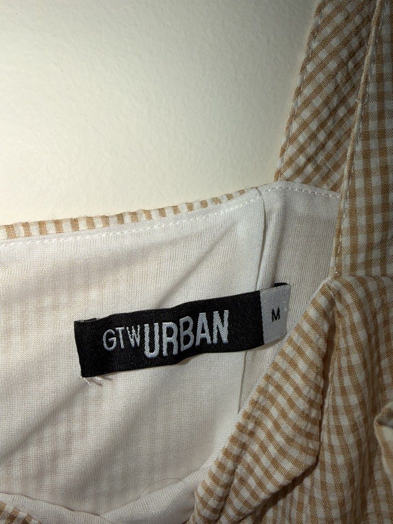 GTW Urban Gingham Square Neck Jumpsuit Size M (Category: Jumpsuits) located in Makati City. Submitted by andzr. (Listing ID 1462392541, Image 3). Description: - Cute gingham jumpsuit from GTW Urban - Features a square neckline and wide straps - Fitted waist with wide leg pants - Versatile for casual outings, easy to style up or down - Please check photos for detailed condition.