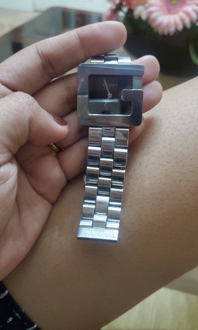 GUCCI 3600 M ORIGINAL/AUNTHENTIC (Category: Luxury Watches) located in Bulacan. Submitted by haze0108 (Listing ID 1462374462, Image 3). Description: Brand & Model: Gucci 3600M Case Shape: Square "G" Logo Material: Polished Stainless Steel case and link bracelet Movement: Swiss Quartz (Battery operated) Markings Visible: Engraved with "GUCCI 3600M", "STAINLESS STEEL", "WATER RESISTANT", and "SWISS MADE" across the case back edges..