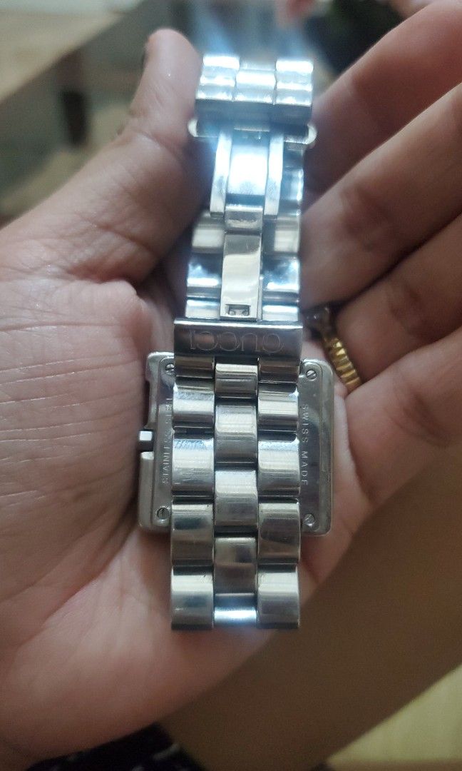 GUCCI 3600 M ORIGINAL/AUNTHENTIC (Category: Luxury Watches) located in Bulacan. Submitted by haze0108 (Listing ID 1462374462, Image 2). Description: Brand & Model: Gucci 3600M Case Shape: Square "G" Logo Material: Polished Stainless Steel case and link bracelet Movement: Swiss Quartz (Battery operated) Markings Visible: Engraved with "GUCCI 3600M", "STAINLESS STEEL", "WATER RESISTANT", and "SWISS MADE" across the case back edges..