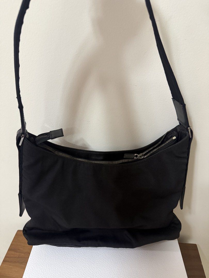 Gucci Black Nylon Shoulder Bag AUTHENTIC (Category: Luxury Bags & Wallets) located in Quezon City. Submitted by sbcarrot (Listing ID 1462388640, Image 2). Description: - Authentic Gucci shoulder bag - Color: Black - Material: Nylon with leather accents - Adjustable strap .