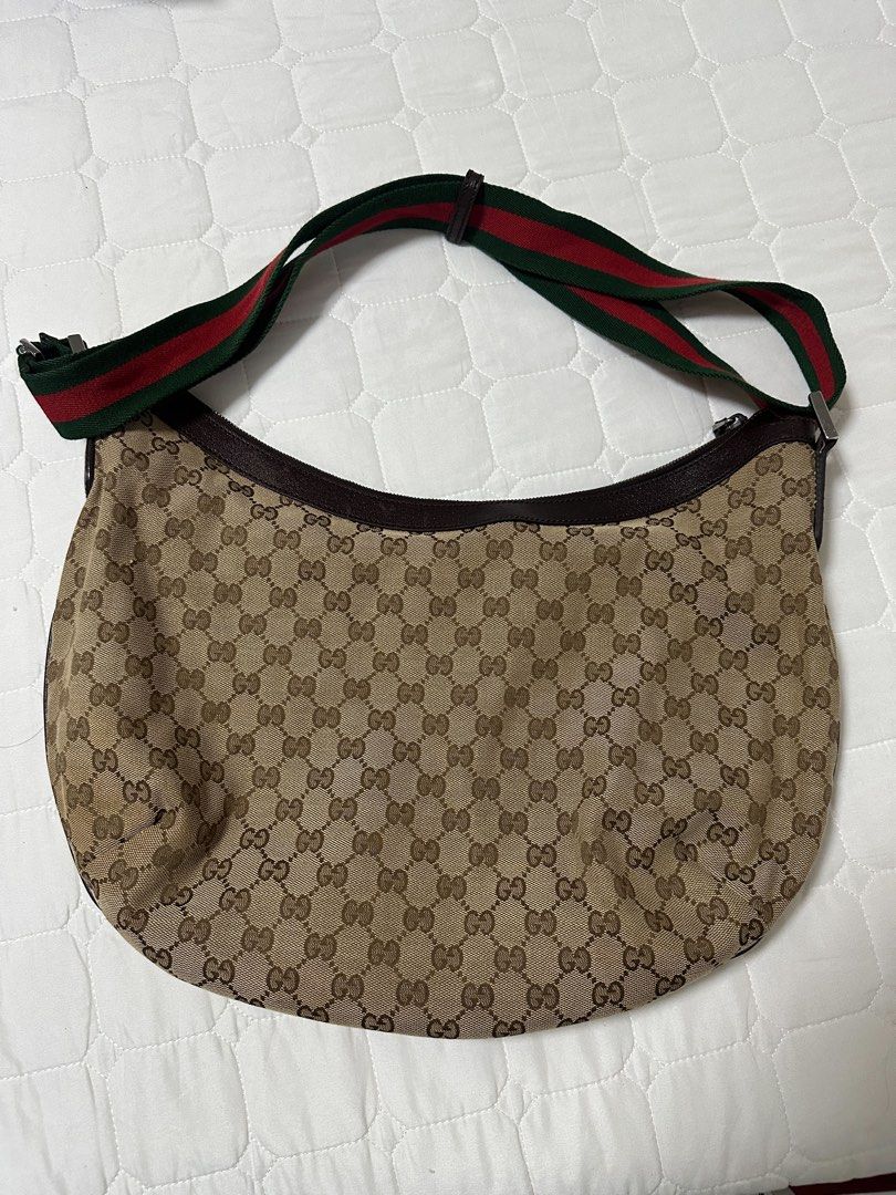 Gucci Canvas Web Half Moon Crossbody bag (Category: Luxury Bags & Wallets) located in Quezon City. Submitted by tresmarias.arc (Listing ID 1462433951, Image 2). Description: Gucci Canvas Web Half Moon Crossbody bag Rank A, good condition With dustbag Negotiable.